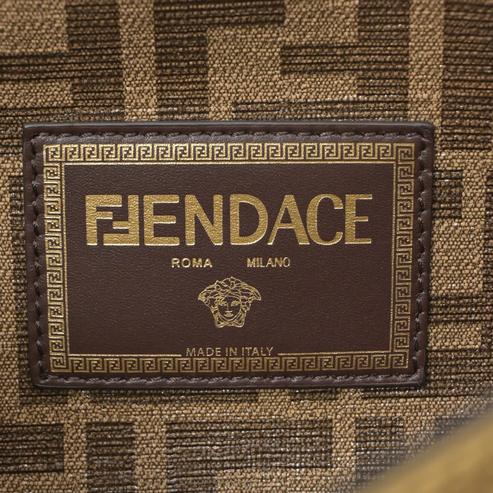 Fendace Brooch Baguette Bag in Gold Leather